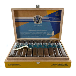 Open wooden box of AVO Syncro South America cigars with blue label on a white background