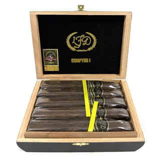 Open wooden box containing cigars with a visible brand logo on a white background