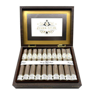 Open wooden cigar box with Rocky Patel Dark Star cigars inside on a white background