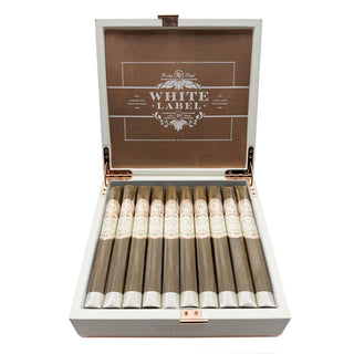 Open cigar box with Rocky Patel White Label cigars inside.