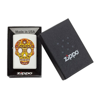 Zippo lighters with colorful skull design in packaging on a white background