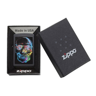 Zippo lighter with colorful skull design in a black box.