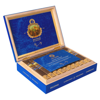 Open wooden cigar box with blue interior and AJ Fernandez New World Decenio cigars on a white background