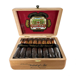 Open box of Arturo Fuente Hemingway cigars on white background