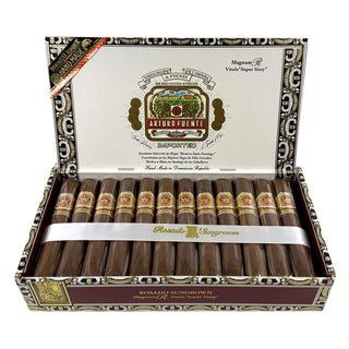 Open box of Arturo Fuente cigars with visible branding on a white background
