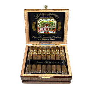 Open wooden box of Arturo Fuente cigars with cigars inside on a white background