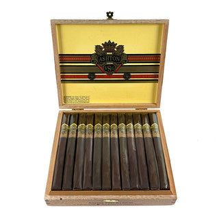 Open wooden box of cigars with Ashton VSG logo on a white background