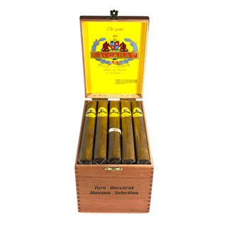 Open wooden box of Baccarat Havana cigars with a yellow label featuring branding on a white background