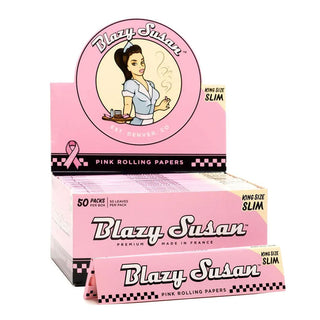 Box of Blazy Susan pink rolling papers with a vintage-style illustration on a white background.