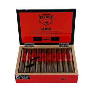Camacho Corojo cigars in an open wooden box with red lid on a white background