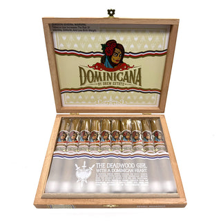 Open wooden box of Deadwood Dominicana cigars with branding and product details.