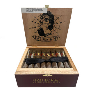Open wooden cigar box of Deadwood Leather Rose cigars with a spider web design on the lid.
