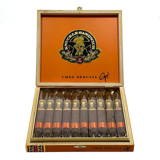 Open wooden box of Espinosa Knuckle Sandwich Chefs Special cigars with orange interior and visible brand logo on a white background