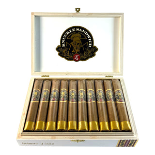 Open wooden box of cigars with 'Knuckle Sandwich' branding on a white background