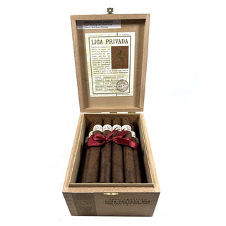 Open wooden box containing Liga Privada H99 cigars on a white background.