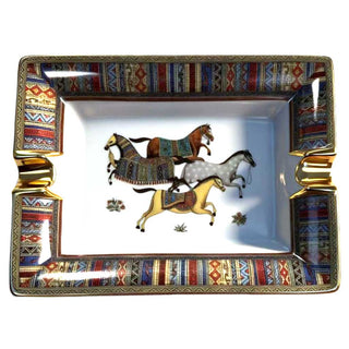 Decorative cigar ashtray tray with horse designs and colorful border on a white background