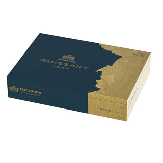 Cigar box with 'Macanudo Emissary France' branding on a white background
