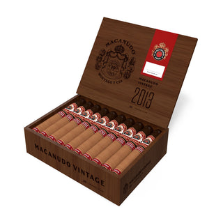 Open box of Macanudo Vintage Maduro 2013 cigars with a red label on a white background