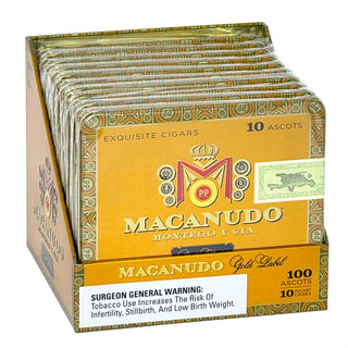 Macanudo Gold Label cigars with decorative patterns on a white background