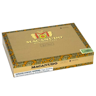 Box of Macanudo Gold Label cigars with decorative patterns on a white background