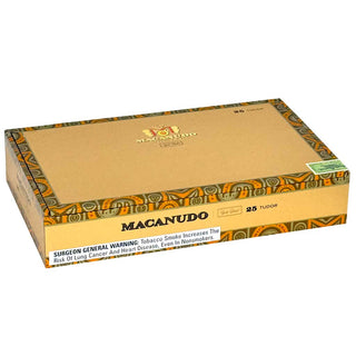 Box of Macanudo Gold Label cigars with decorative patterns on a white background