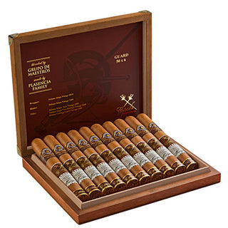 Open wooden box of Montecristo Espada cigars with cigars inside on a white background
