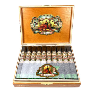 Open wooden humidor with My Father La Opulencia Toro cigars on a white background