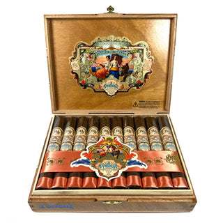Open wooden cigar box with My Father La Promesa Toro cigars on a white background