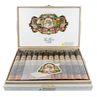Open wooden cigar box with a decorative label on a white background