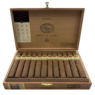 Open wooden humidor filled with Padron 1926 Series Natural cigars on a white background