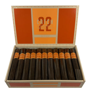 Box of Rocky Patel Catch 22 Corojo cigars with orange design on white background.