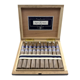 Wooden cigar box with Rocky Patel Vintage 2003 Cameroon cigars on a white background