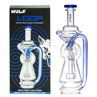 Clear Puffco Peak glass smoking attachment with blue accents next to its packaging