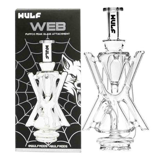 Glass Puffco Peak smoking attachment with WULF branding on a black spider web background