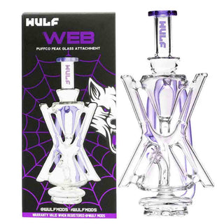 Clear Puffco Peak glass smoking attachment with purple accents on a black box featuring WULF branding.